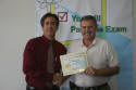 David receives his workshop certificate.