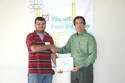 Barrett receiving his Workshop Completion Certificate