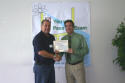 Juan receives his class certificate
